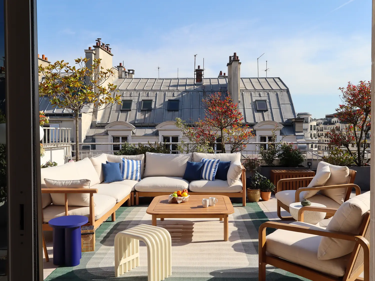 Rooftop space with outdoor lounge and a view over Paris rooftops